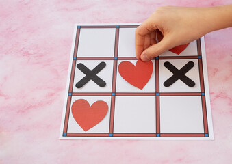 Valentine's day concept with hearts X-O game. Holiday