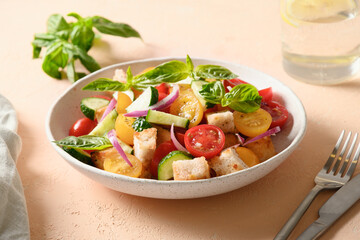 Tuscan Panzanella with tomatoes and croutons. Italian cuisine. Vegetarian salad. Mediterranean healthy food. Close up.