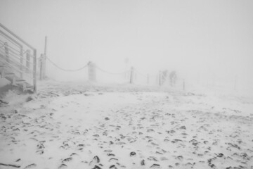Winter landscape. The peak of Sniezka, Karkonosze Mountains on the border of Poland and the Czech Republic. Black and white.