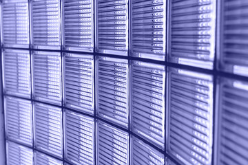 Lilac wall of modern glass building of business center.