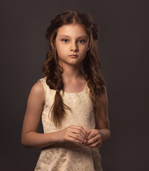 Beauty portrait of wedding clean makeup kid girl with stylish braid hair style. Closeup brunette...