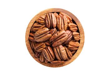 pecan nuts peeled in wooden bowl isolated on white background. Vegan food, top view.