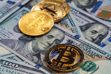 Bitcoin on 100 dollar bill background