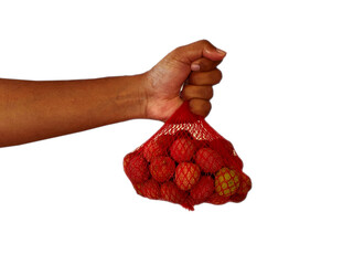 Hand holding a bag of lychee fruits against a white background