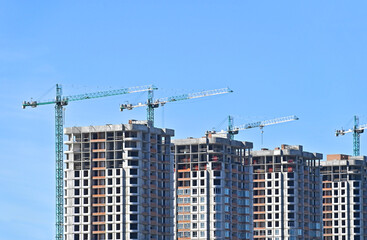 Fototapeta premium Crane and highrise construction site