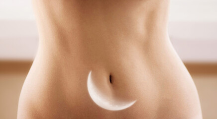 Female stomach with moon multiple exposure image. Menstruation and woman health concept.