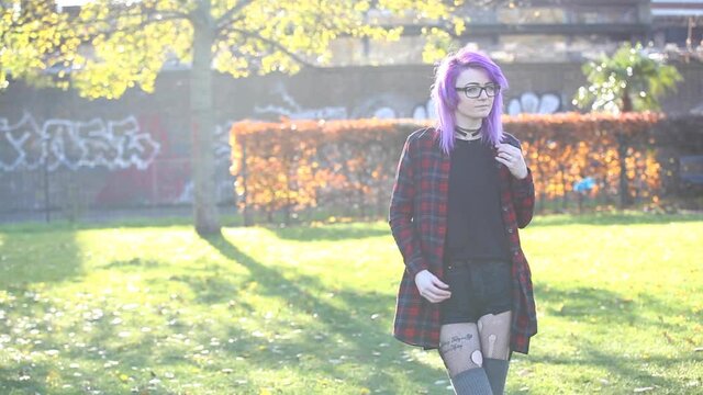 Portrait of alternative young woman in London at park