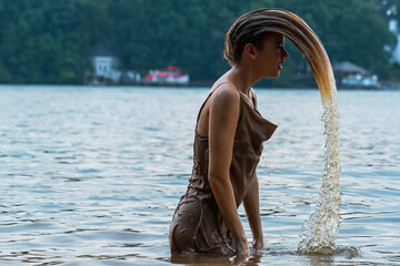 A Lovely Blonde Model Enjoys A Day At The Lake