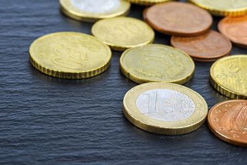 Euro coins on black background. Selective view
