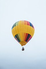 Colorful hot air balloon flying on a cloudy day