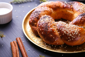 Russian national bread Kalach on a dark background