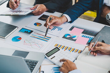 Meeting concept Business team hands at working with financial plan, meeting, discussion, brainstorm with tablet on the office desk,