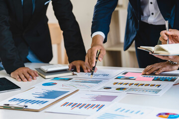 Meeting concept Business team hands at working with financial plan, meeting, discussion, brainstorm with tablet on the office desk,