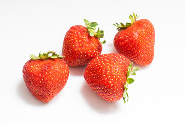 Ripe red strawberries on a white background