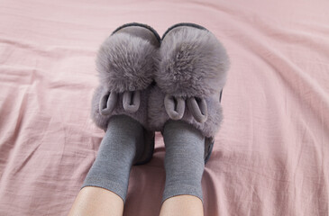 Soft comfortable home slippers. Gray color slippers and socks.