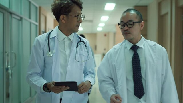  Asian Doctors are working in hospital , medical health care concept