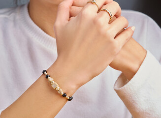 Bracelets. Unisex gold bracelet on woman hand