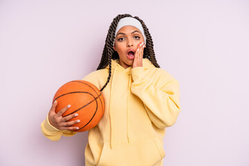 black afro woman feeling shocked and scared. basketball concept