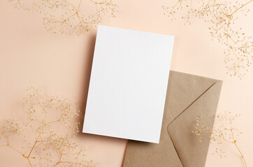 Invitation or greeting card mockup with envelope and dry gypsophila flowers