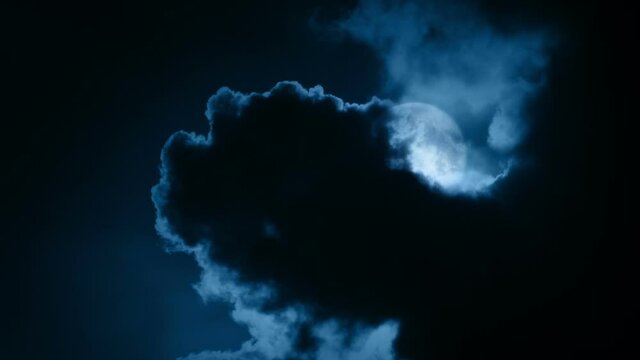 Dramatic Moon Comes Out From Behind Dark Clouds