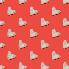 Pattern of stones in the shape of a heart of love for Valentine's Day on a red background