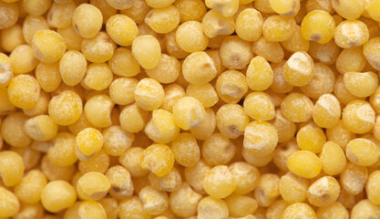 Close-up of millet groats as background.