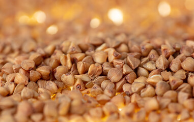 Close-up of buckwheat groats as background. - obrazy, fototapety, plakaty