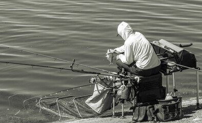 A man fishing with a rod