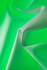 Green fabric material as an abstract background.