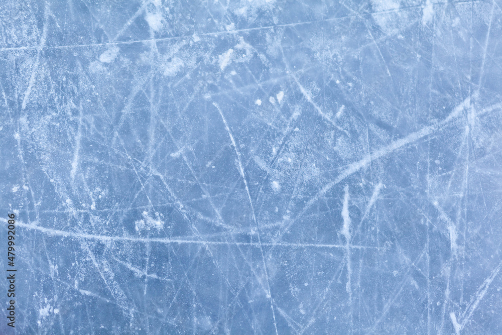 Aufkleber empty ice rink with skate marks after the session outdoor. skating ice rink texture covered with sno