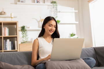 Entrepreneur beautiful business asian young woman wear casual work online with laptop at home.Freelance woman working online sale marketing,Shopping online at home.Small Business Startup concept
