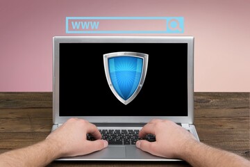 Business person working on computer, icon security, shield, confidentiality of users data.