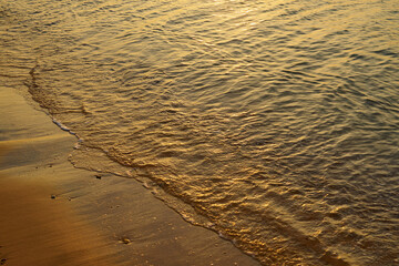 Waves on the tropical sandy beach of the red sea.