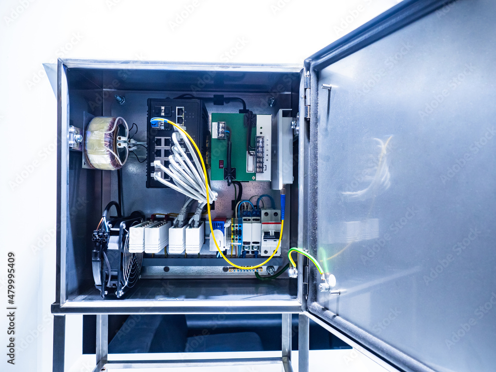 Aufkleber electrical equipment. cabinet with network equipment. server instruments and wires inside metal box.