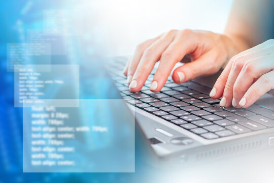 Programming background. Hands on keyboard. Programmer's hands next to blurred code. Code symbolizes development of programs. Wallpaper on theme of development. Background with program code