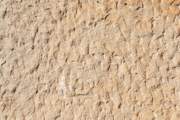 texture of a natural rough-cut stone of an ancient building