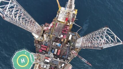 Aerial view maintenance repair of the jack up oil and gas rig up in the shipyard, Offshore oil and Gas processing platform, oil and gas industry.