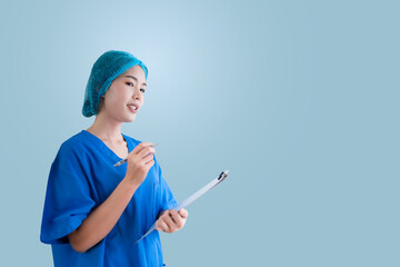 Asian female doctor in blue surgical gown, isolated background