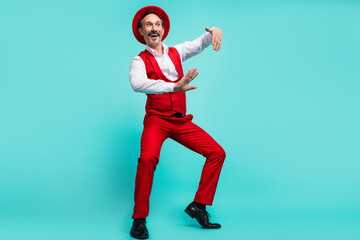 Fototapeta na wymiar Full length photo of aged man have fun dance chill playful look empty space isolated over teal color background