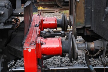 The front buffers and couplings of a USA class steam locomotive at Tenterden Town station on the Kent and East Sussex Railway. The engine was built in 1943 for the US Army Corps of Engineers.