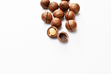 a scattering of macadamia nuts on a white background