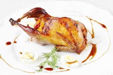 baked quail stuffed with corn grits and sun-dried tomatoes. holiday dish