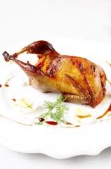 baked quail stuffed with corn grits and sun-dried tomatoes. holiday dish