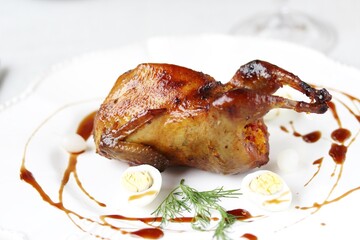 baked quail stuffed with corn grits and sun-dried tomatoes. holiday dish