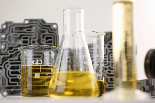 Test tube chemistry flask against of hydroblock acp with yellow liquid