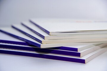 Annual report book pile in the university library