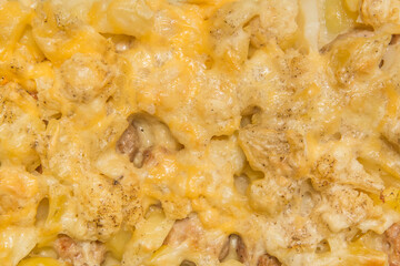 Baked potatoes with meat and cheese background of hearty home-grown food with spices