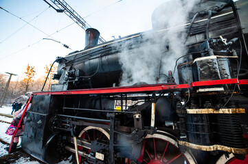 Naklejka premium Steam engine on a locomotive. Old mechanisms