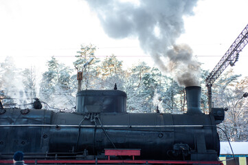 Fototapeta na wymiar Old steam engine on a railway locomotive