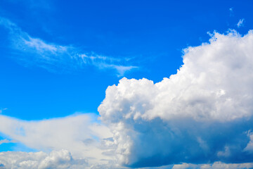 Obraz premium Blue sky with white cumulus clouds. Banner. Background. Nature wallpaper. Sunny weather forecast. Religion concept. Heaven landscape. Outdoor scenic. Bright pattern design. Copy space. Fresh air